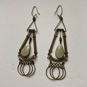 Brass exotic earrings with cream coloured insert stone